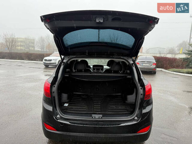 Черный Хендай Туксон, объемом двигателя 2.4 л и пробегом 143 тыс. км за 12000 $, фото 20 на Automoto.ua