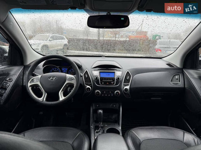 Черный Хендай Туксон, объемом двигателя 2.4 л и пробегом 143 тыс. км за 12000 $, фото 14 на Automoto.ua