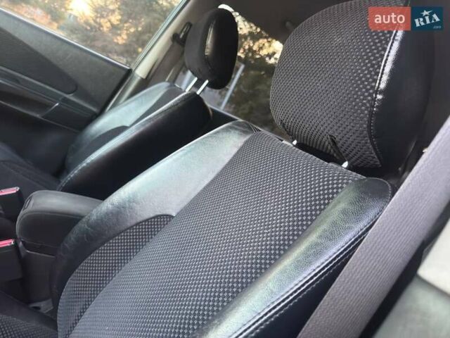 Черный Хендай Туксон, объемом двигателя 1.98 л и пробегом 140 тыс. км за 9671 $, фото 29 на Automoto.ua