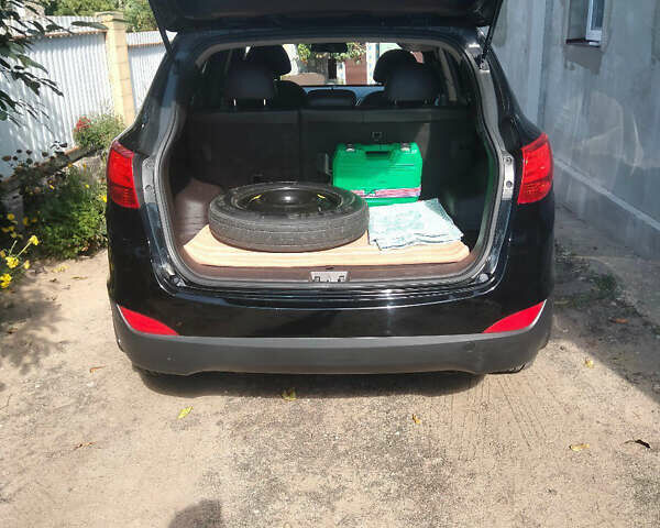 Черный Хендай Туксон, объемом двигателя 2.36 л и пробегом 151 тыс. км за 13000 $, фото 2 на Automoto.ua