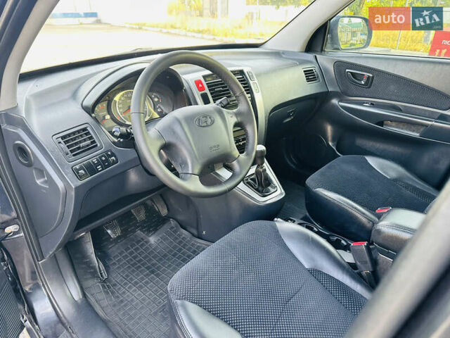 Черный Хендай Туксон, объемом двигателя 2 л и пробегом 119 тыс. км за 9600 $, фото 24 на Automoto.ua