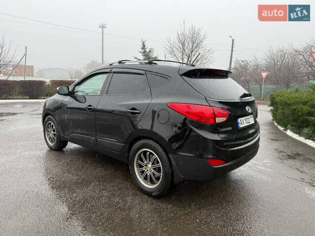 Черный Хендай Туксон, объемом двигателя 2.4 л и пробегом 143 тыс. км за 12000 $, фото 11 на Automoto.ua