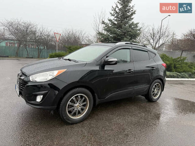 Черный Хендай Туксон, объемом двигателя 2.4 л и пробегом 143 тыс. км за 12000 $, фото 9 на Automoto.ua