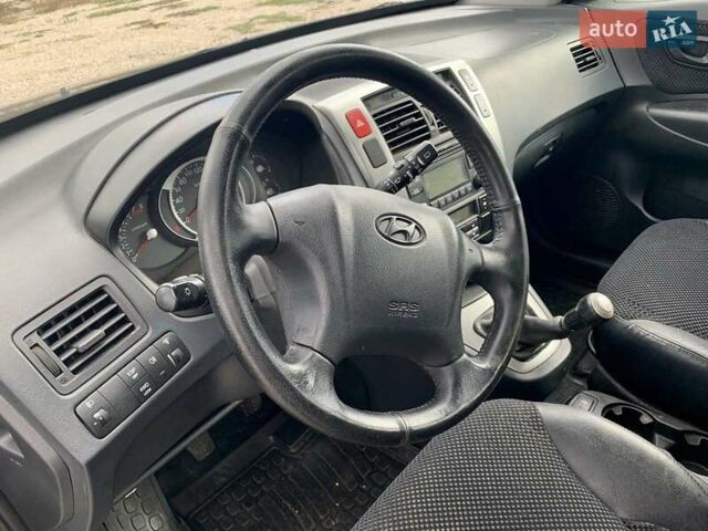 Черный Хендай Туксон, объемом двигателя 1.98 л и пробегом 158 тыс. км за 8200 $, фото 10 на Automoto.ua