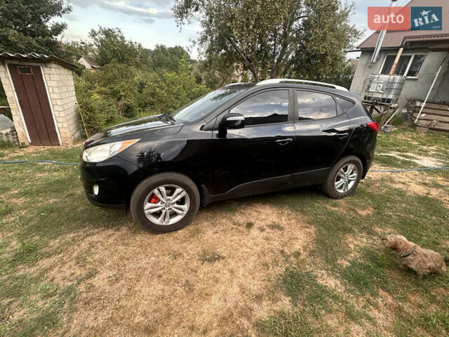 Черный Хендай Туксон, объемом двигателя 2.36 л и пробегом 151 тыс. км за 13000 $, фото 7 на Automoto.ua