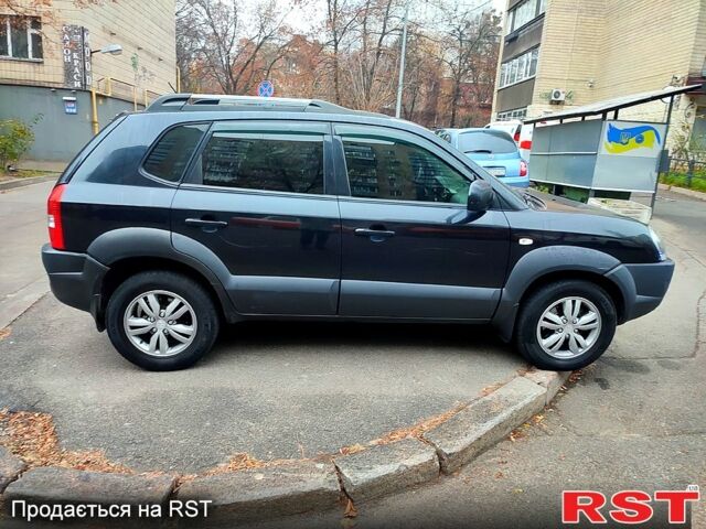 Черный Хендай Туксон, объемом двигателя 2 л и пробегом 258 тыс. км за 9000 $, фото 1 на Automoto.ua