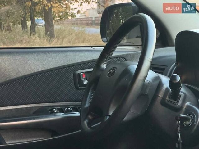 Черный Хендай Туксон, объемом двигателя 1.98 л и пробегом 140 тыс. км за 9671 $, фото 46 на Automoto.ua