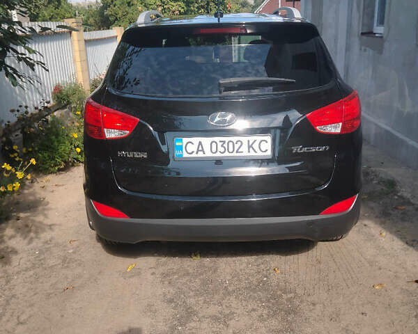 Черный Хендай Туксон, объемом двигателя 2.36 л и пробегом 151 тыс. км за 13000 $, фото 4 на Automoto.ua