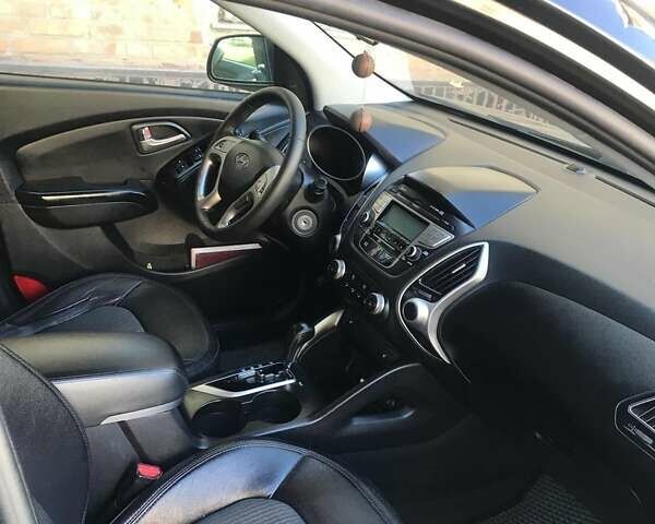 Черный Хендай Туксон, объемом двигателя 2.4 л и пробегом 132 тыс. км за 12900 $, фото 3 на Automoto.ua