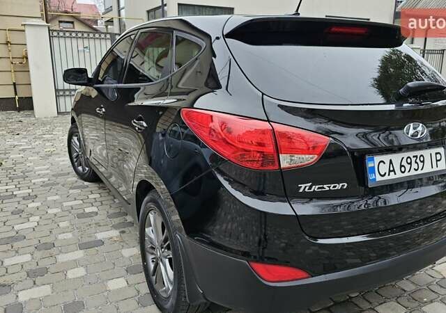 Чорний Хендай Туксон, об'ємом двигуна 2 л та пробігом 160 тис. км за 12300 $, фото 4 на Automoto.ua