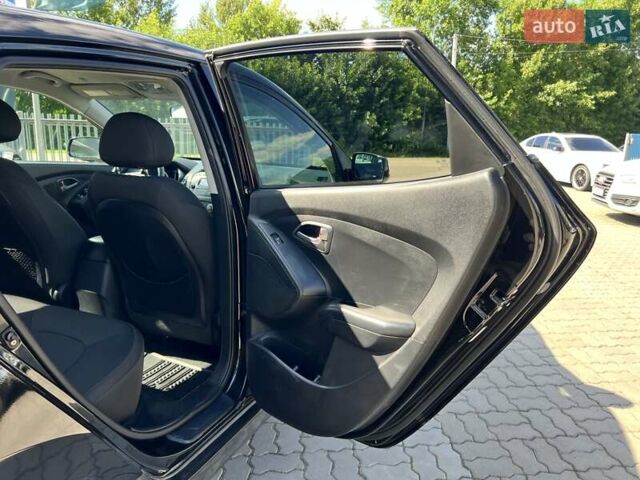 Чорний Хендай Туксон, об'ємом двигуна 2 л та пробігом 164 тис. км за 11490 $, фото 25 на Automoto.ua