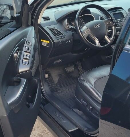 Черный Хендай Туксон, объемом двигателя 2.4 л и пробегом 130 тыс. км за 12400 $, фото 11 на Automoto.ua