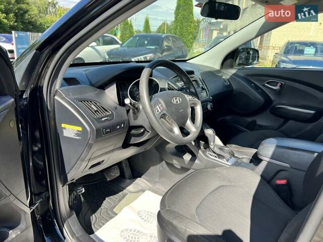 Чорний Хендай Туксон, об'ємом двигуна 2 л та пробігом 164 тис. км за 11490 $, фото 13 на Automoto.ua