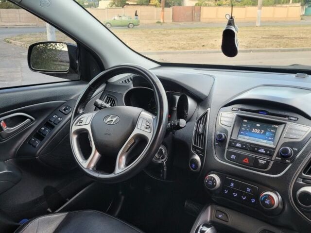 Черный Хендай Туксон, объемом двигателя 2.4 л и пробегом 130 тыс. км за 12400 $, фото 13 на Automoto.ua