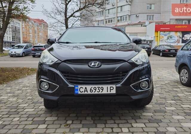 Чорний Хендай Туксон, об'ємом двигуна 2 л та пробігом 160 тис. км за 12300 $, фото 26 на Automoto.ua