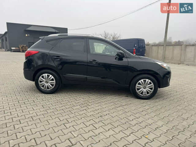 Черный Хендай Туксон, объемом двигателя 2.36 л и пробегом 205 тыс. км за 11200 $, фото 3 на Automoto.ua