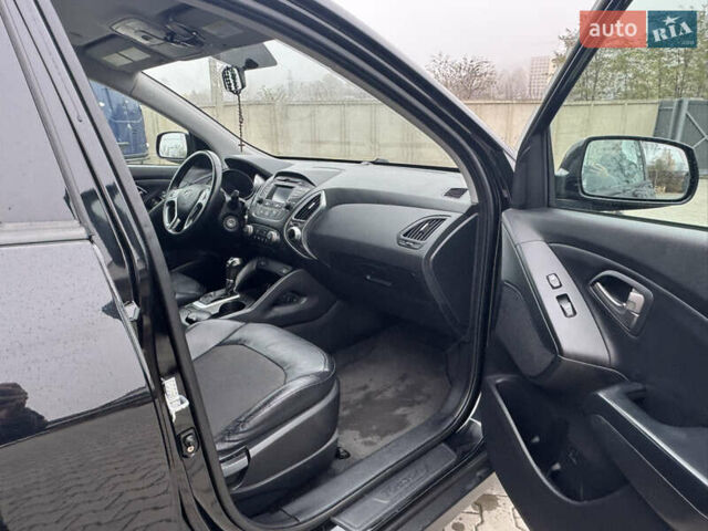Черный Хендай Туксон, объемом двигателя 2.36 л и пробегом 205 тыс. км за 11200 $, фото 11 на Automoto.ua