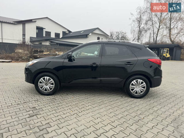 Черный Хендай Туксон, объемом двигателя 2.36 л и пробегом 205 тыс. км за 11200 $, фото 7 на Automoto.ua