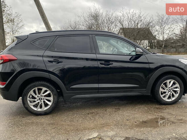 Черный Хендай Туксон, объемом двигателя 2 л и пробегом 190 тыс. км за 18000 $, фото 4 на Automoto.ua