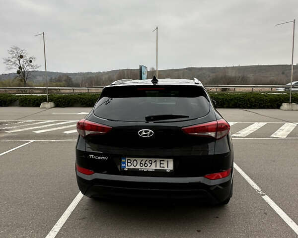 Черный Хендай Туксон, объемом двигателя 2 л и пробегом 120 тыс. км за 17800 $, фото 5 на Automoto.ua