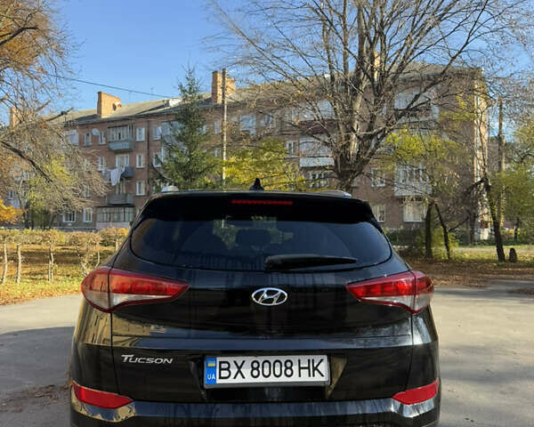 Черный Хендай Туксон, объемом двигателя 2 л и пробегом 100 тыс. км за 16300 $, фото 4 на Automoto.ua