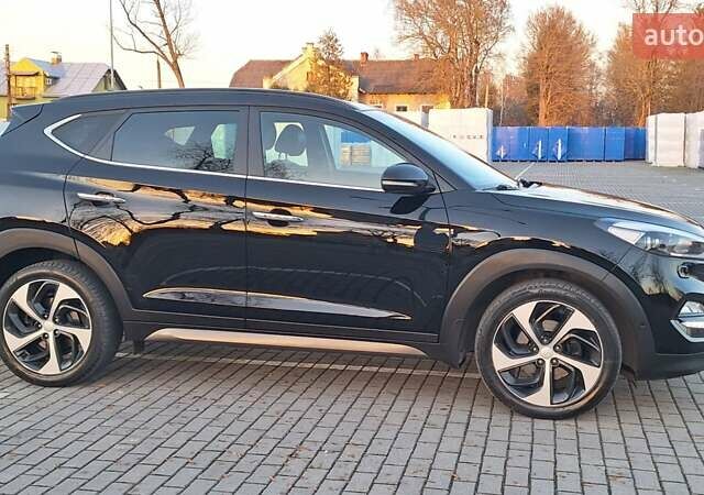 Чорний Хендай Туксон, об'ємом двигуна 2 л та пробігом 192 тис. км за 21000 $, фото 7 на Automoto.ua