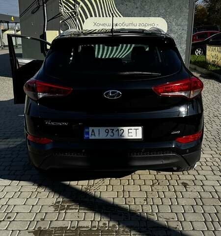 Черный Хендай Туксон, объемом двигателя 2 л и пробегом 222 тыс. км за 14000 $, фото 6 на Automoto.ua