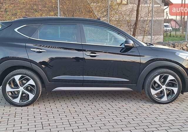 Черный Хендай Туксон, объемом двигателя 2 л и пробегом 192 тыс. км за 19999 $, фото 6 на Automoto.ua