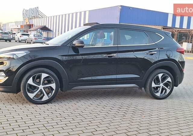 Черный Хендай Туксон, объемом двигателя 2 л и пробегом 192 тыс. км за 19999 $, фото 1 на Automoto.ua