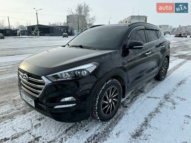 Черный Хендай Туксон, объемом двигателя 2 л и пробегом 103 тыс. км за 18500 $, фото 1 на Automoto.ua