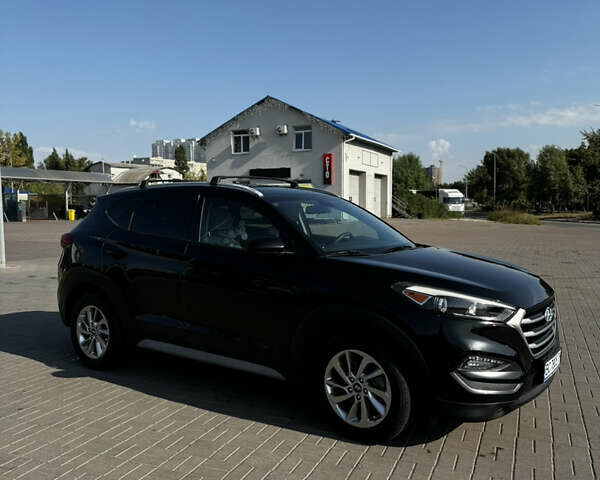 Черный Хендай Туксон, объемом двигателя 2 л и пробегом 110 тыс. км за 18000 $, фото 5 на Automoto.ua