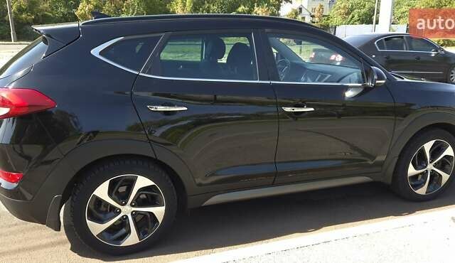 Черный Хендай Туксон, объемом двигателя 2 л и пробегом 44 тыс. км за 20500 $, фото 4 на Automoto.ua