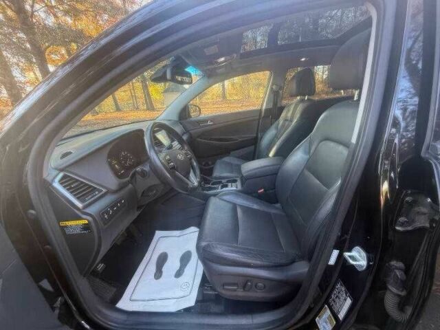 Черный Хендай Туксон, объемом двигателя 1.6 л и пробегом 99 тыс. км за 9600 $, фото 8 на Automoto.ua