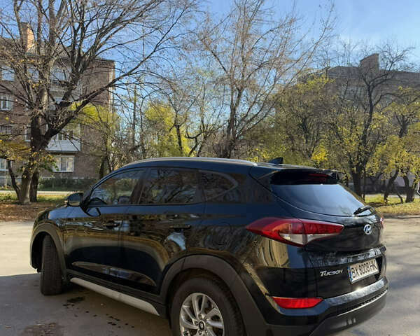 Черный Хендай Туксон, объемом двигателя 2 л и пробегом 100 тыс. км за 16300 $, фото 3 на Automoto.ua