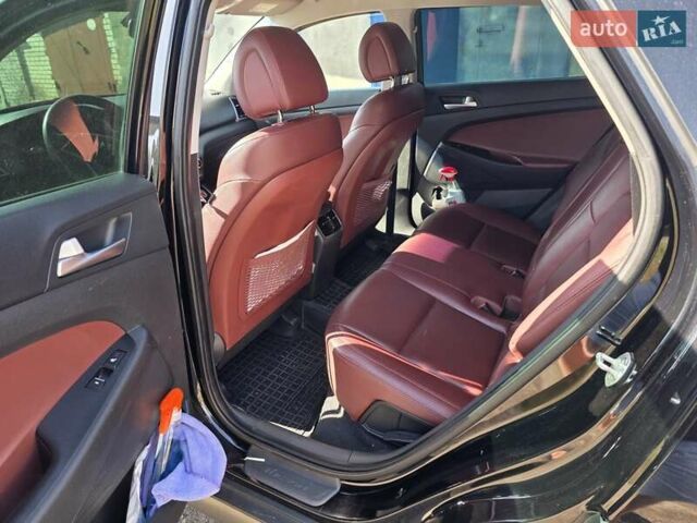 Черный Хендай Туксон, объемом двигателя 1.98 л и пробегом 112 тыс. км за 18300 $, фото 11 на Automoto.ua