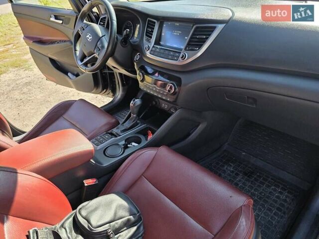 Черный Хендай Туксон, объемом двигателя 1.98 л и пробегом 112 тыс. км за 18300 $, фото 10 на Automoto.ua