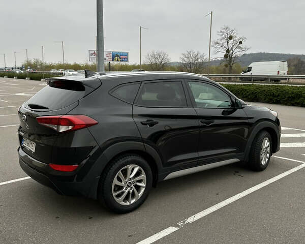 Черный Хендай Туксон, объемом двигателя 2 л и пробегом 120 тыс. км за 17800 $, фото 8 на Automoto.ua