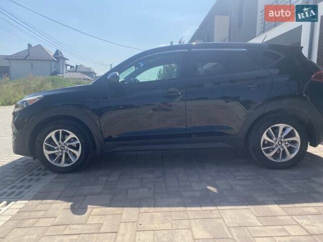 Черный Хендай Туксон, объемом двигателя 2 л и пробегом 126 тыс. км за 14500 $, фото 3 на Automoto.ua