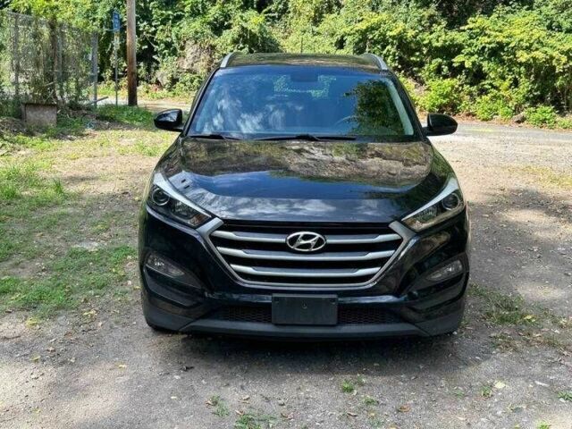 Черный Хендай Туксон, объемом двигателя 2 л и пробегом 83 тыс. км за 4400 $, фото 7 на Automoto.ua