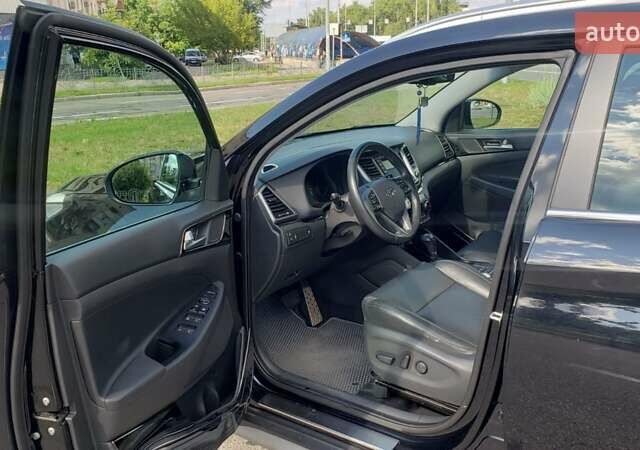 Черный Хендай Туксон, объемом двигателя 1.59 л и пробегом 101 тыс. км за 20600 $, фото 1 на Automoto.ua