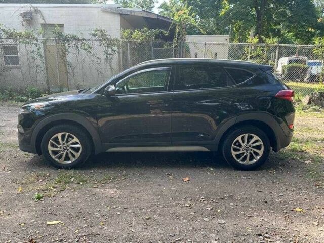 Черный Хендай Туксон, объемом двигателя 2 л и пробегом 83 тыс. км за 4400 $, фото 5 на Automoto.ua