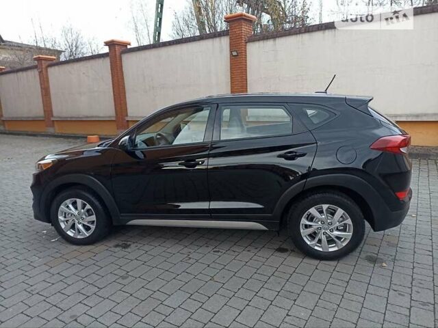 Черный Хендай Туксон, объемом двигателя 2 л и пробегом 107 тыс. км за 14800 $, фото 9 на Automoto.ua