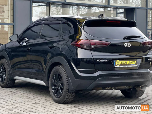 Черный Хендай Туксон, объемом двигателя 2 л и пробегом 106 тыс. км за 17900 $, фото 3 на Automoto.ua