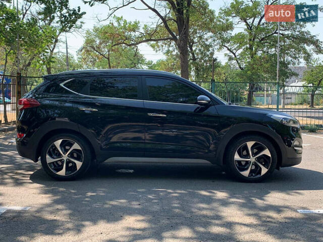 Черный Хендай Туксон, объемом двигателя 2 л и пробегом 122 тыс. км за 19800 $, фото 3 на Automoto.ua