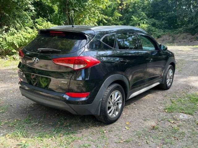 Черный Хендай Туксон, объемом двигателя 2 л и пробегом 83 тыс. км за 4400 $, фото 2 на Automoto.ua
