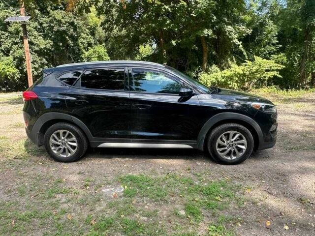 Черный Хендай Туксон, объемом двигателя 2 л и пробегом 83 тыс. км за 4400 $, фото 1 на Automoto.ua