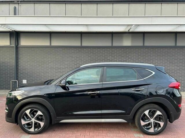 Чорний Хендай Туксон, об'ємом двигуна 1.7 л та пробігом 98 тис. км за 14000 $, фото 4 на Automoto.ua