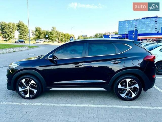 Черный Хендай Туксон, объемом двигателя 2 л и пробегом 98 тыс. км за 24000 $, фото 6 на Automoto.ua