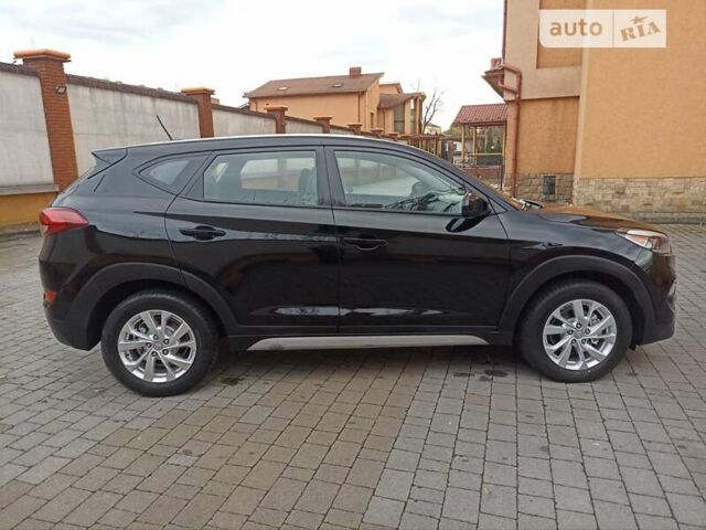 Черный Хендай Туксон, объемом двигателя 2 л и пробегом 107 тыс. км за 14800 $, фото 3 на Automoto.ua