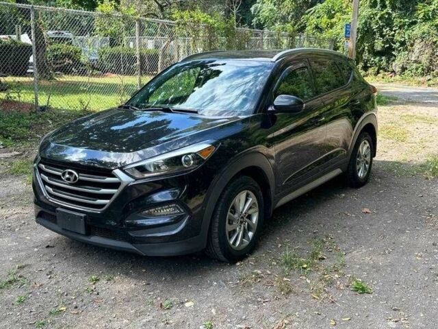 Черный Хендай Туксон, объемом двигателя 2 л и пробегом 83 тыс. км за 4400 $, фото 6 на Automoto.ua